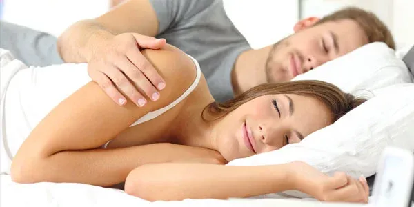 Couple sleeping in bed bug free bed